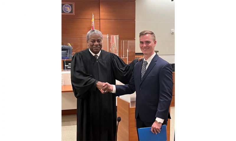 Logan Beckman, Esq. sworn in by Judge Michael A. Robinson